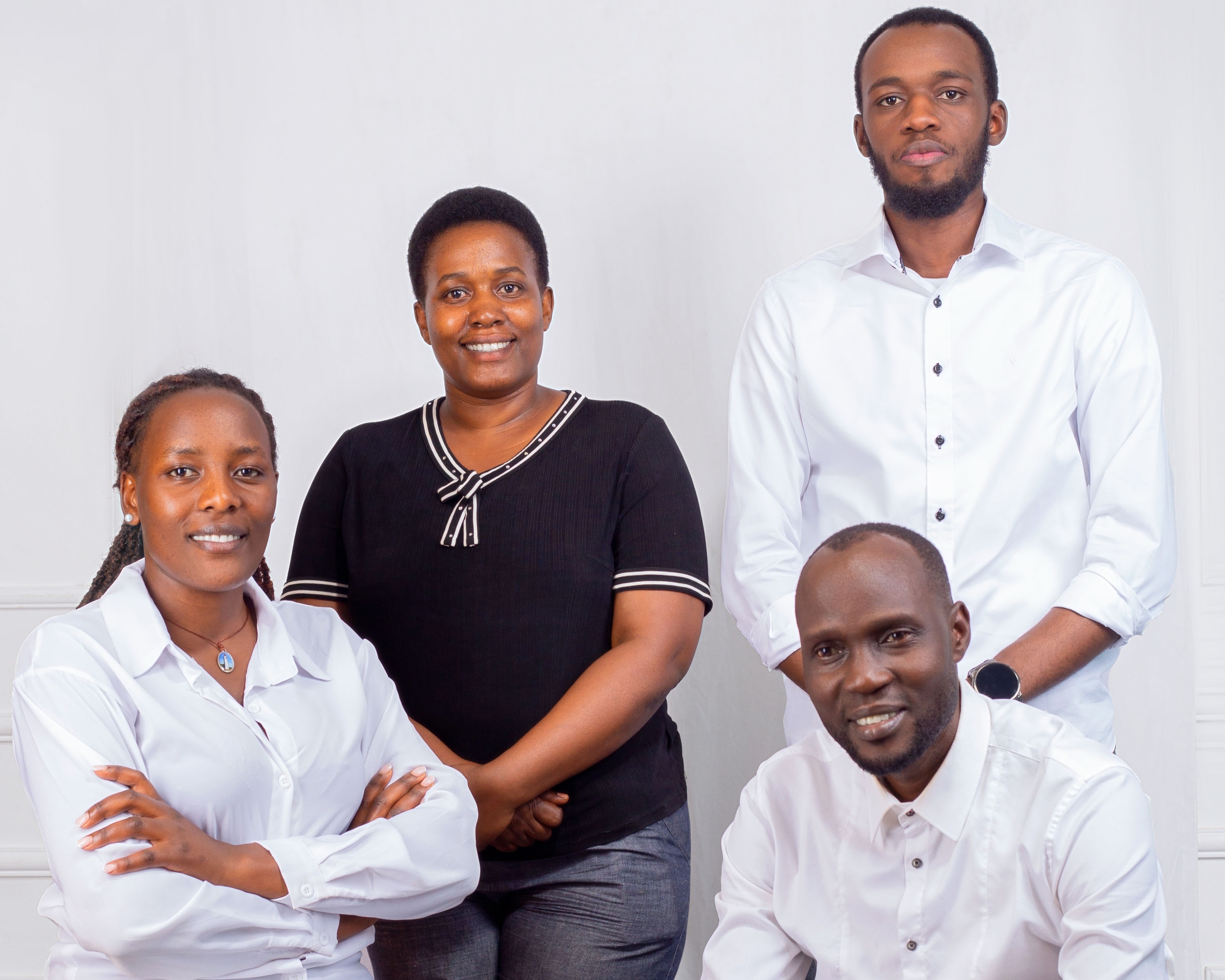 The Nkwasa Foundation team posing together in their office